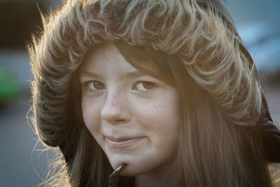 Close-up portrait of girl wearing hooded jacket