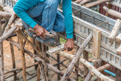 Low section of man working at construction site