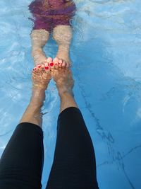 Low section of woman in swimming pool
