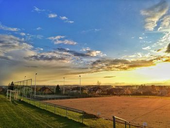 Scenic view of field against sky during sunset