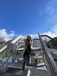 Low angle view of bridge against blue sky