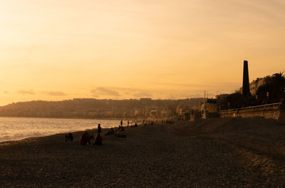 Scenic view of beach against sky during sunset