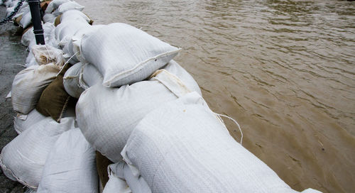 Stack of sack on shore at beach