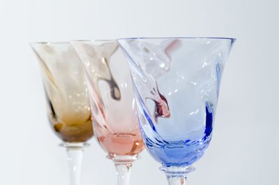 Close-up of beer glass against white background