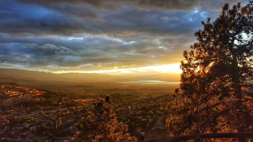Scenic view of silhouette landscape against sky at sunset