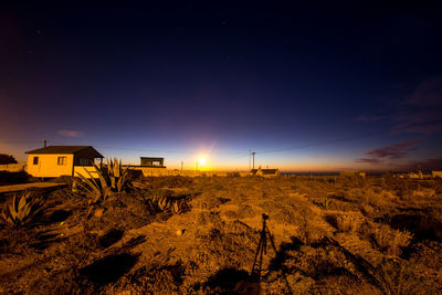 Scenic view of field against sky at night