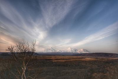 Scenic view of landscape against sky during winter