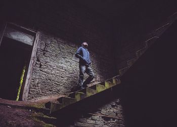 Low angle view of man standing on steps