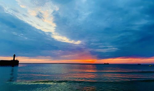 Scenic view of sea against sky during sunset