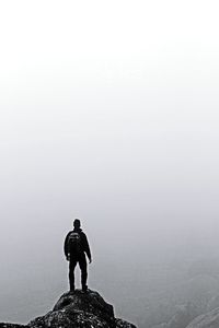 Full length of woman standing on rock