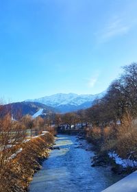 Scenic view of mountains against clear blue sky