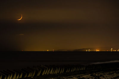 Scenic view of moon against sky at night