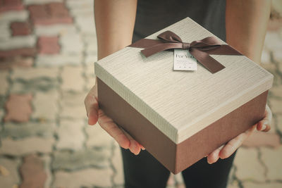 Close-up of woman holding book