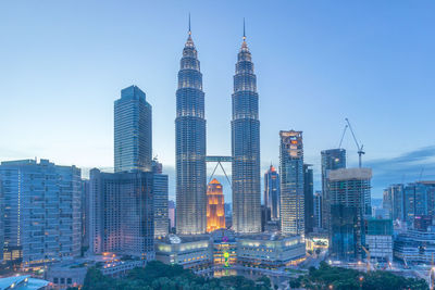 Petronas towers amidst buildings in city