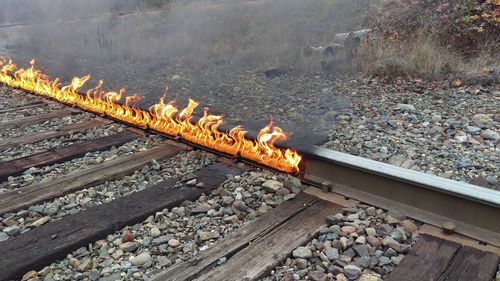 High angle view of fire on railroad track