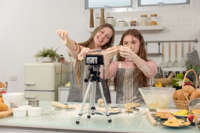 High angle view of woman standing by food