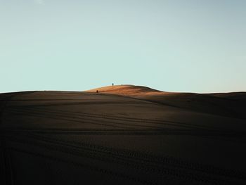 View of desert against clear sky