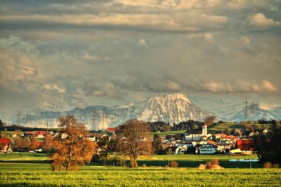 Scenic view of mountains against cloudy sky