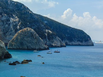 Scenic view of sea and rocks against sky