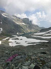 Scenic view of mountains against cloudy sky