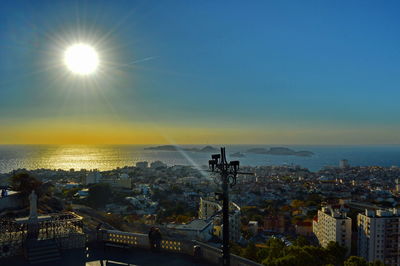 Scenic view of sea against clear sky at sunset