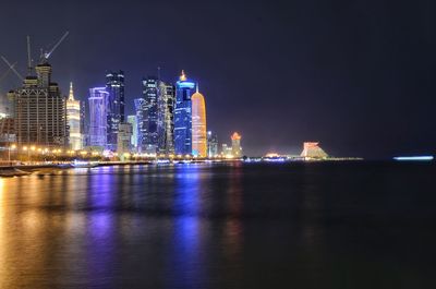 Illuminated buildings in city at night