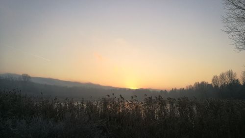 Scenic view of landscape against sky during sunset