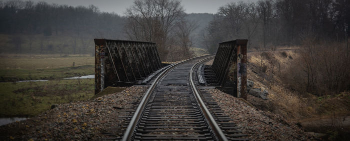 Railroad tracks in foggy weather