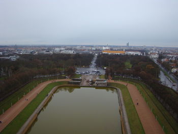 High angle view of bridge over river in city against sky