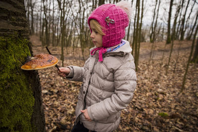 Side view of woman in forest