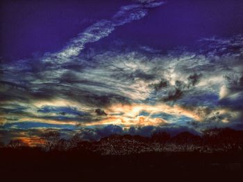 Low angle view of dramatic sky during sunset