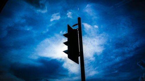 Low angle view of silhouette road against sky