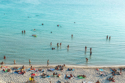 People swimming in sea