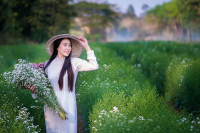 Woman standing on field