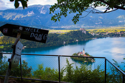 Information sign at observation point overlooking lake