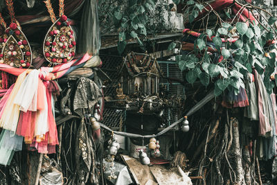 Clothes hanging in market stall for sale