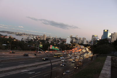 High angle view of city street and buildings against sky