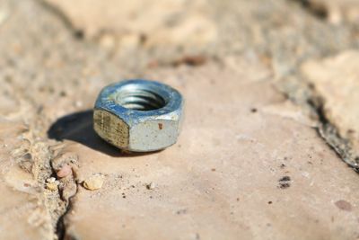 High angle view of metallic object on land