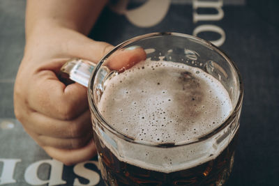 Cropped image of man holding drink