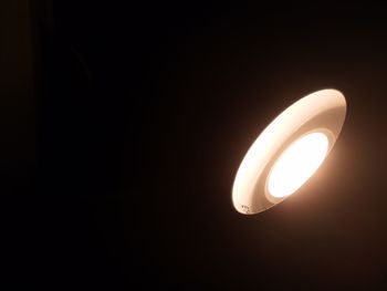 Low angle view of illuminated light bulb