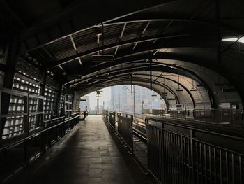 Rear view of man walking in tunnel