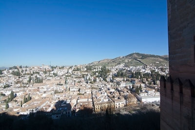 View of town against blue sky