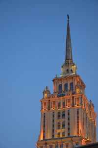 Low angle view of building against blue sky