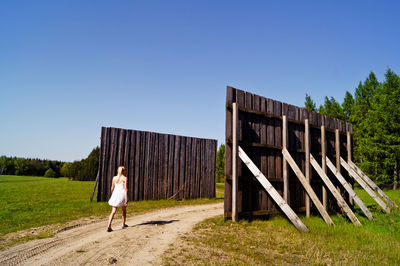 Full length of woman walking in the countryside