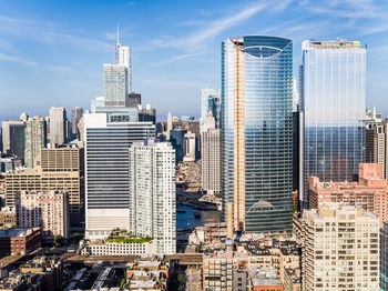 Modern buildings in city against sky