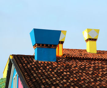 Many colored chimneys in burano island near venice in italy