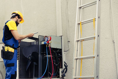 Side view of man working at home