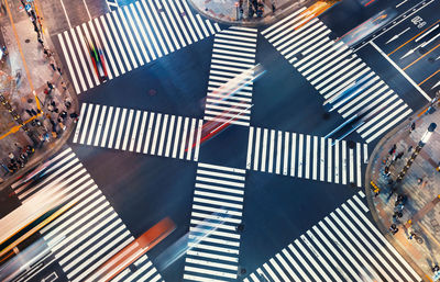 High angle view of umbrella crossing road