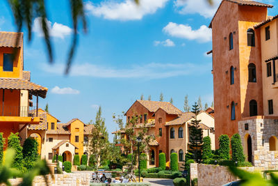 Houses in city against sky