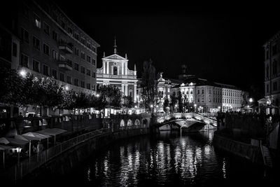 View of buildings lit up at night